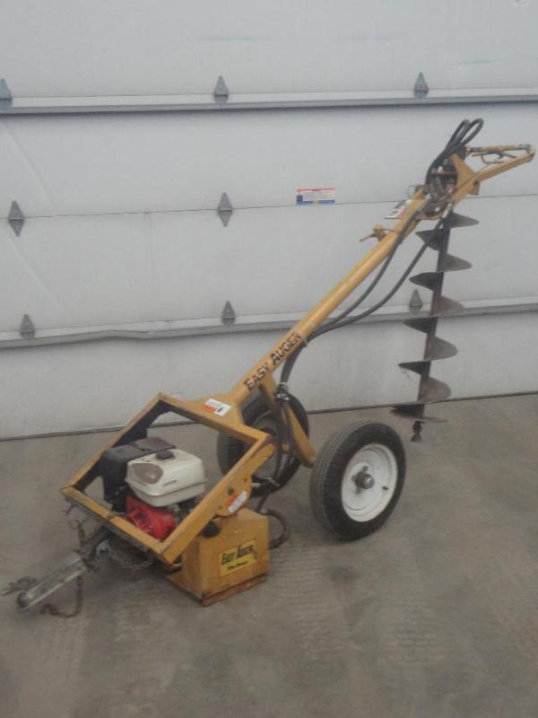 lot 3 image: MacKissie Easy-Auger Towable Gas Po...
