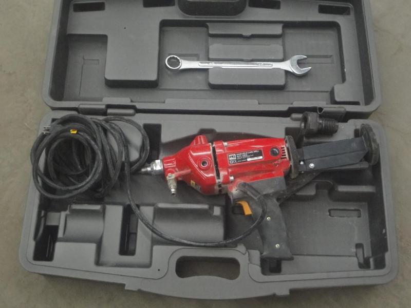 lot 77 image: Multiquip Handheld Model CDM1H Core...
