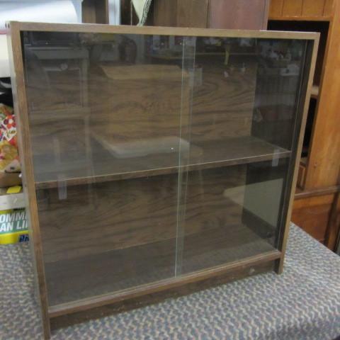 Small display cabinet with sliding ...