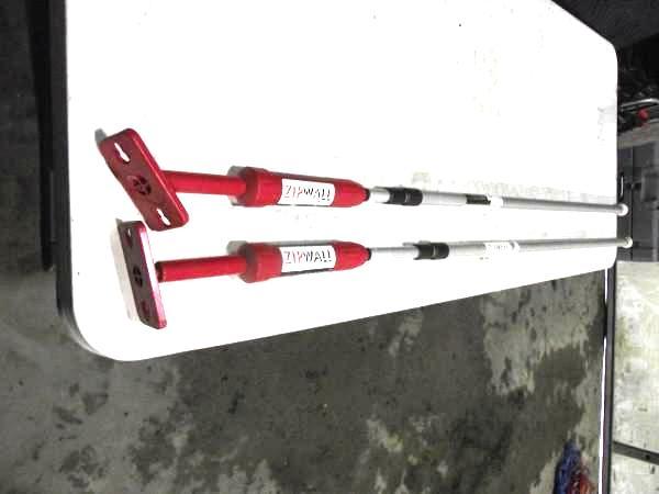 lot 52 image: (2) Zip-Wall Jacks   Easily...