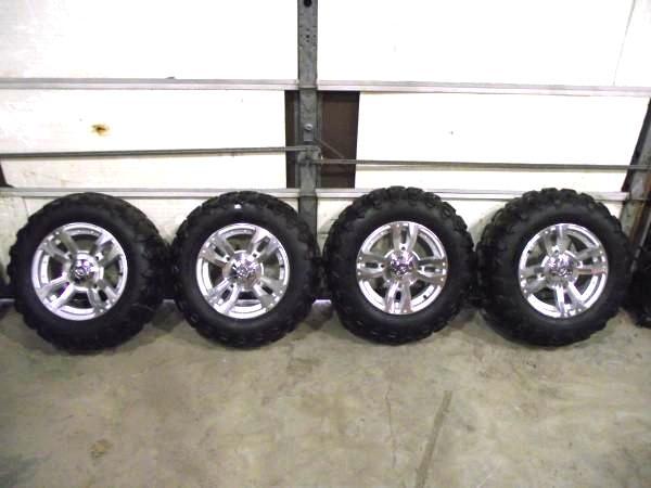 lot 75 image: Polaris XP Rims with Carlisle Tires...