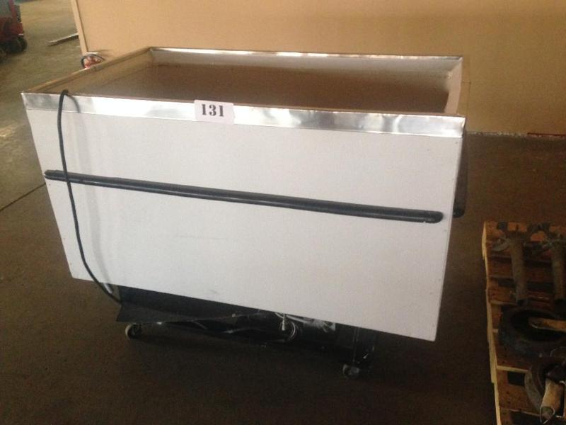 Chest freezer on wheels. No top....