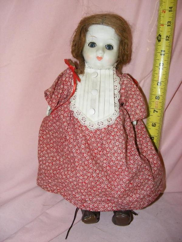 lot 100 image: Porcelain Doll...