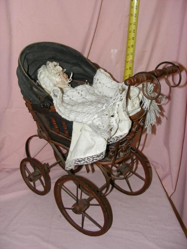lot 130 image: Porcelain Baby Doll in Baby Buggy...