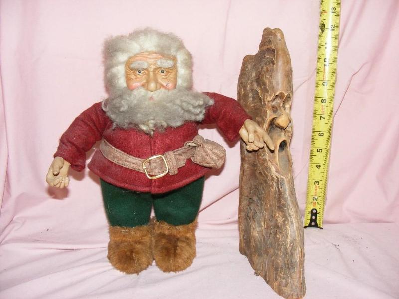 lot 14 image: Troll doll and spooky face wood dec...