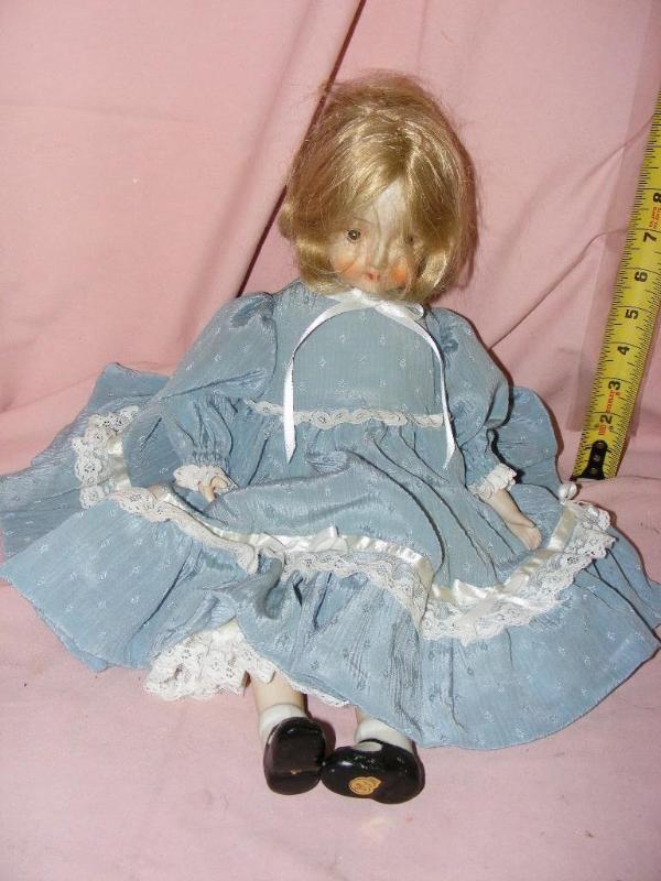 lot 161 image: Toddler Doll with light blue dress...