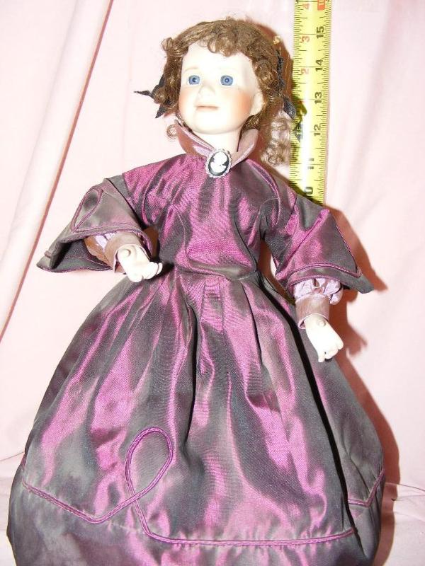 lot 164 image: Doll in Purple Dress, approx 15 t...