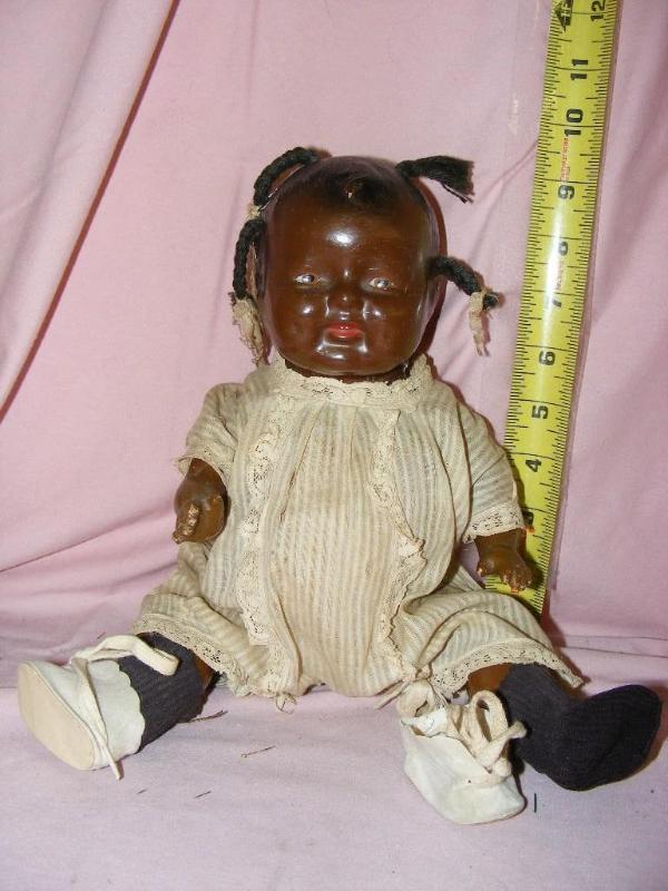lot 174 image: African American Baby Doll, missing...