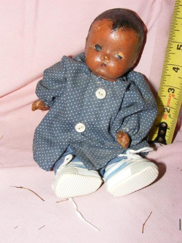 lot 175 image: African American Baby Doll, damage...