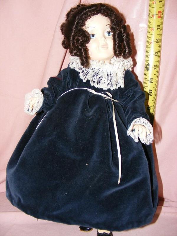 lot 183 image: Doll in blue velvet dress...