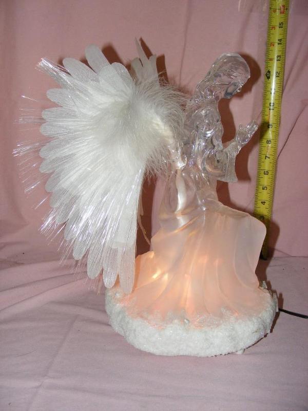 lot 21 image: Lighted Angel, works. Her wings als...