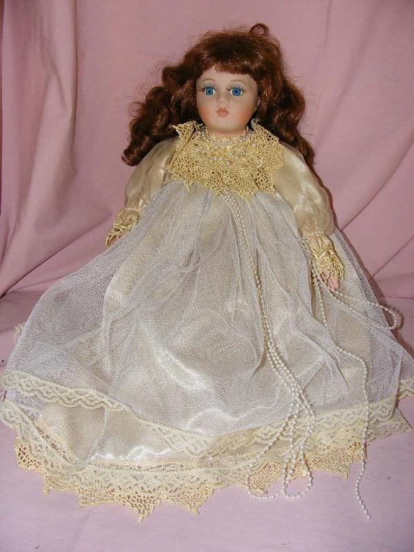 lot 26 image: Porcelain Doll, no makers mark...