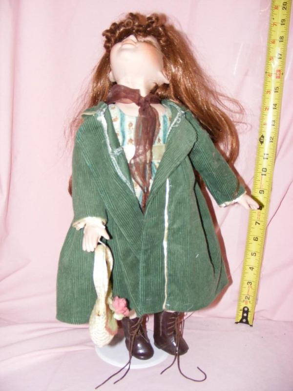 lot 27 image: Porcelain Doll...