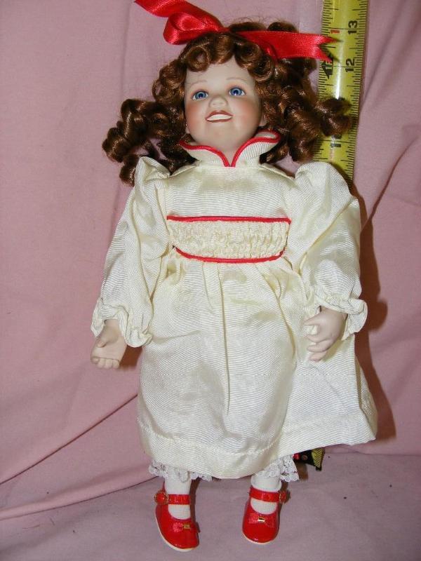 lot 28 image: Porcelain Doll, M2854...