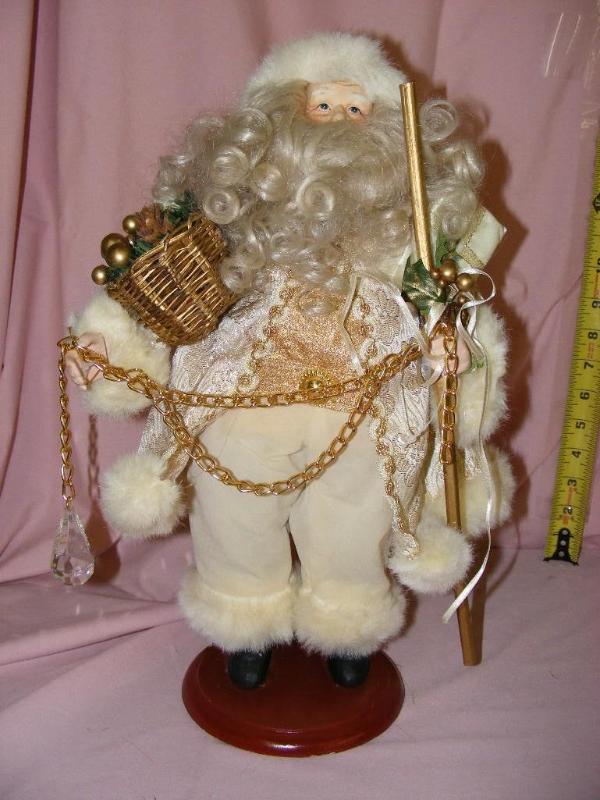 lot 33 image: Santa Doll dressed in white with go...