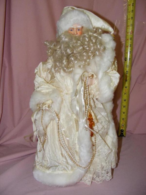 lot 34 image: Santa Tree Topper, dressed in white...