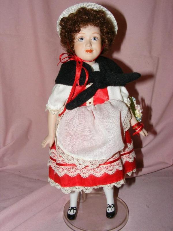 lot 65 image: Porcelain Doll, on stand...