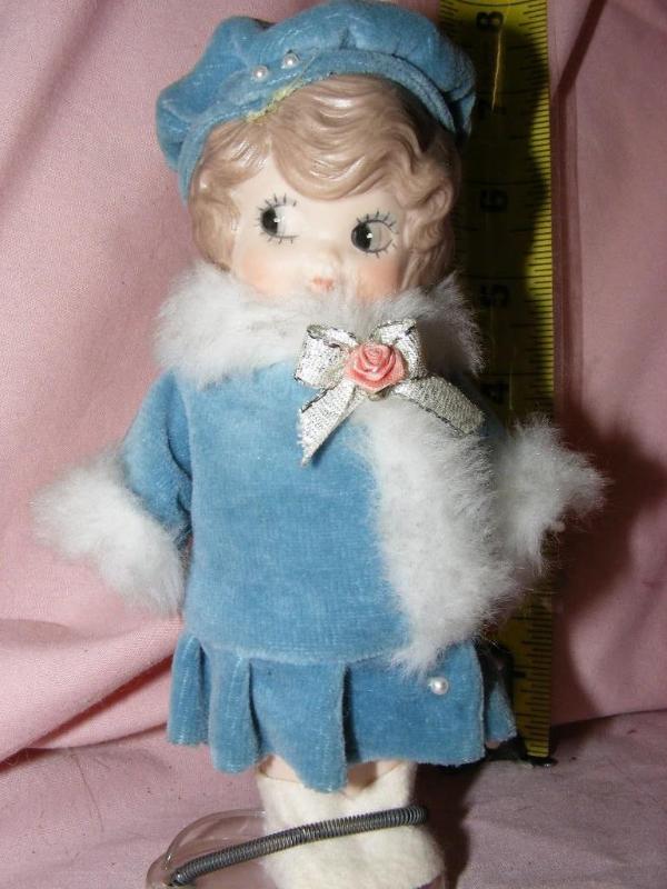 lot 71 image: Doll in Blue outfit, approx 7 tal...
