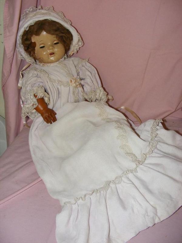 lot 91 image: Old Baby Doll, face is cracked and ...