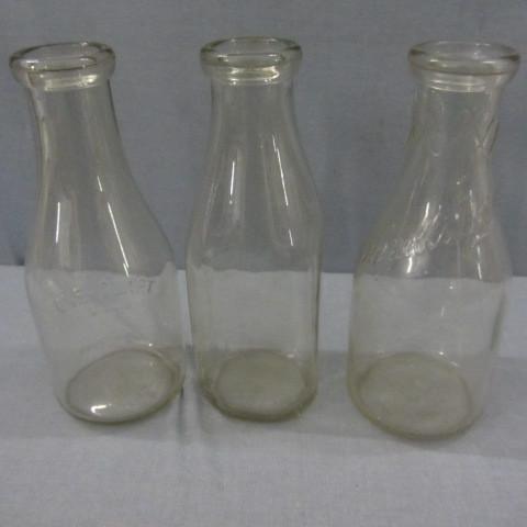 Quart milk bottles one with Schnel...