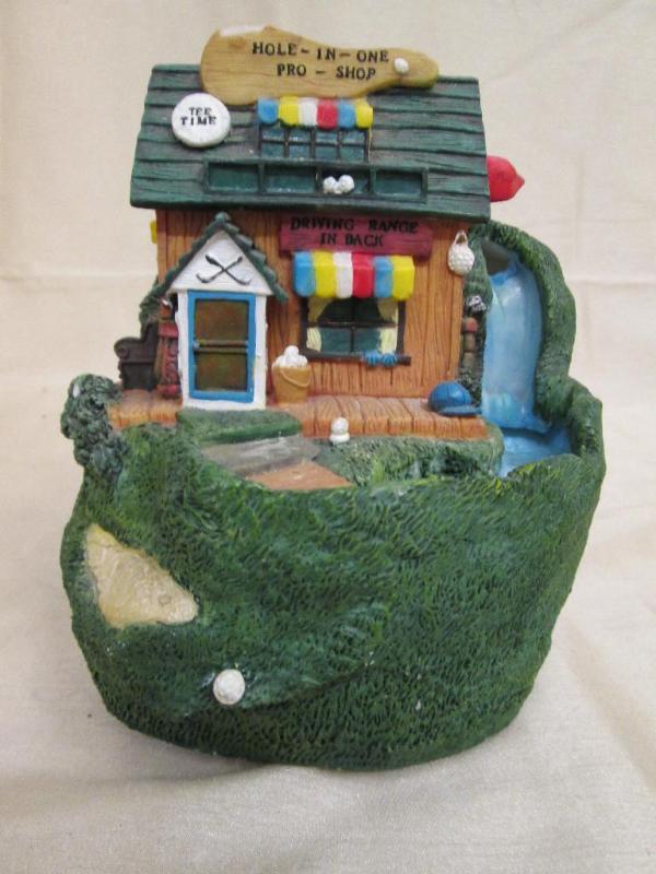 lot 108 image: Golf club house fountain....