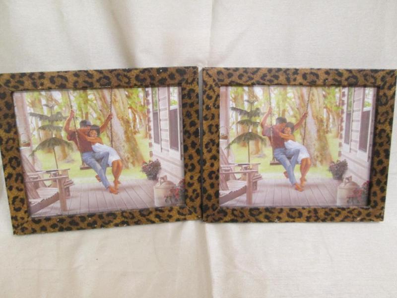 lot 133 image: Pair of identical pictures in leopa...