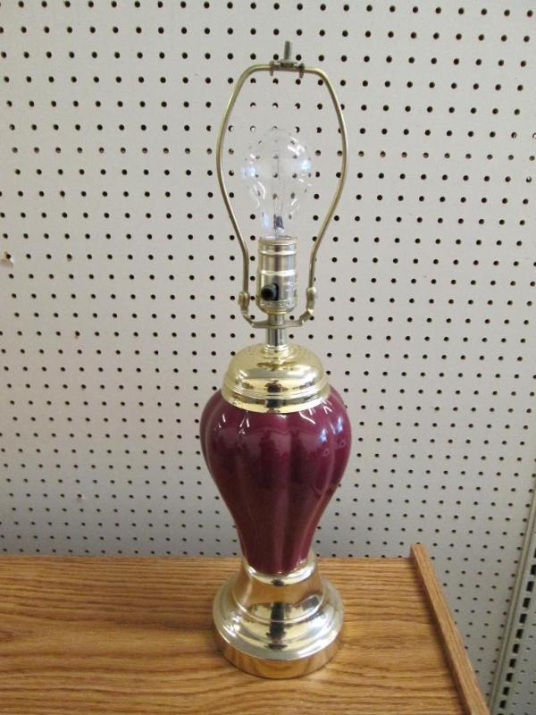 lot 137 image: New burgundy lamp with gold accents...