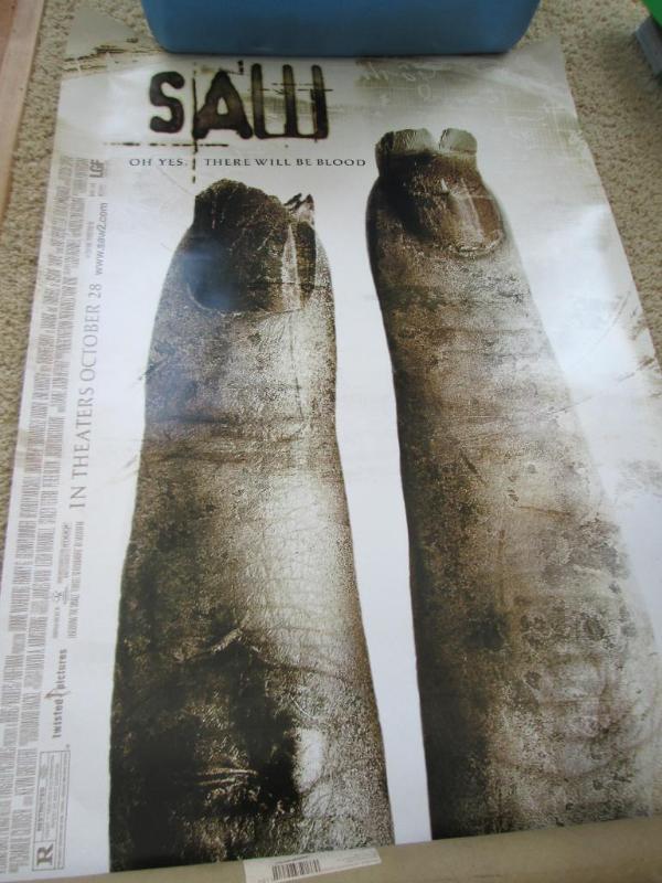 lot 56 image: Double sided SAW movie poster 27.5 ...