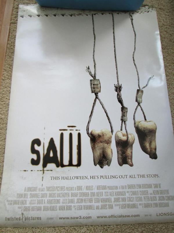lot 57 image: Double sided SAW movie poster 27.5 ...