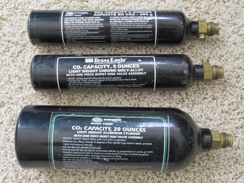 lot 62 image: 3 Brass Eagle paintball CO2 tanks, ...