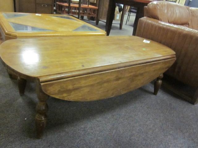 lot 149 image: Drop leaf solid wood coffee table....