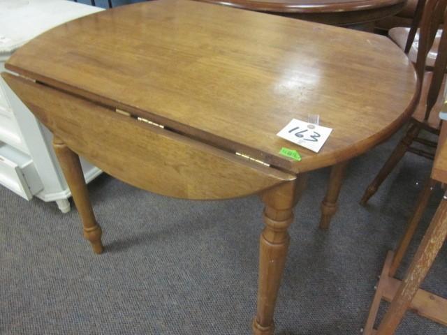 lot 163 image: Drop leaf solid wood dining table....