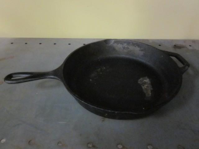 lot 9 image: 10" Lodge cast iron pan.  ...