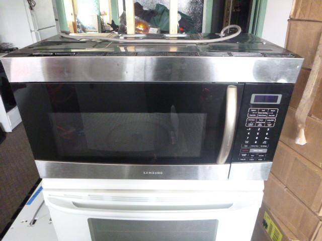 lot 17 image: Samsung Over the Range Microwave