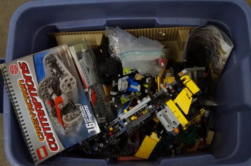 a tub full of legosand construction...