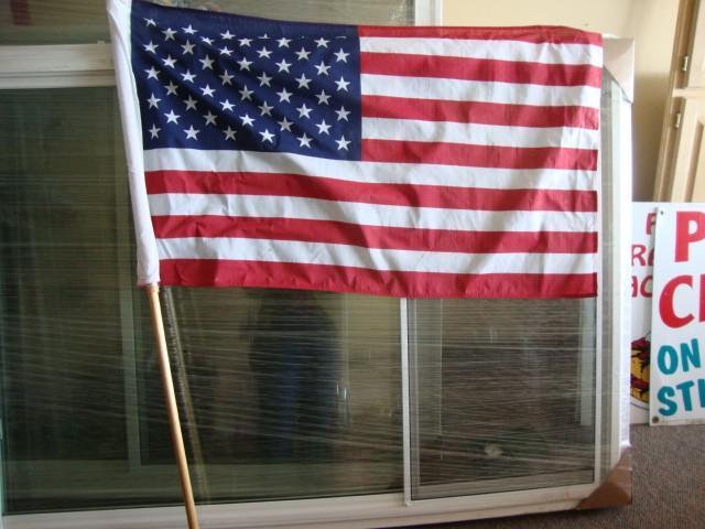 lot 15 image: American Flag with pole. Both in pe...