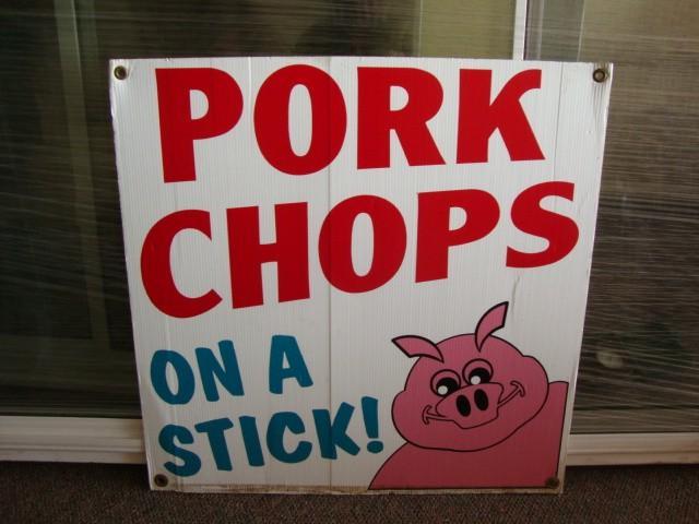lot 16 image: Pork chop on a Stick laminate sign....
