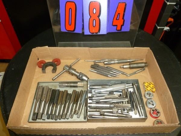 lot 84 image: Flat of taps and dies. As shown. Ca...