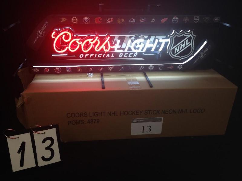 Coors Light hockey sticks. Brand ne...
