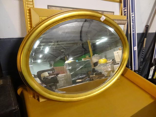 lot 104 image: Oval wall hanging mirror....
