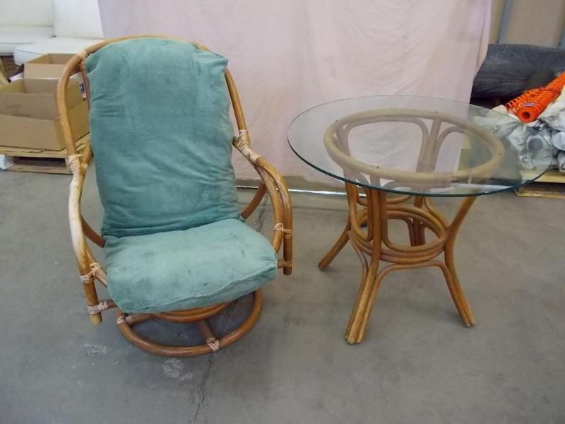 lot 22 image: A bamboo glass top table and a bamb...