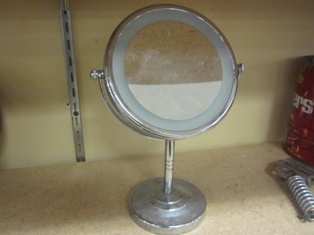 Small round metal makeup mirror....