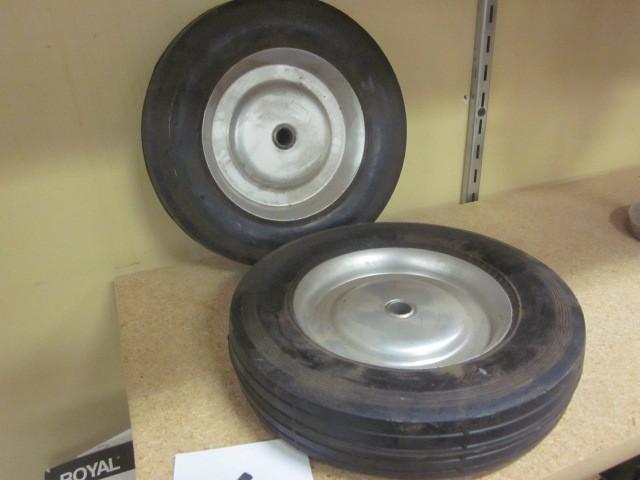 Pair of hard rubber wheels. &nbsp...