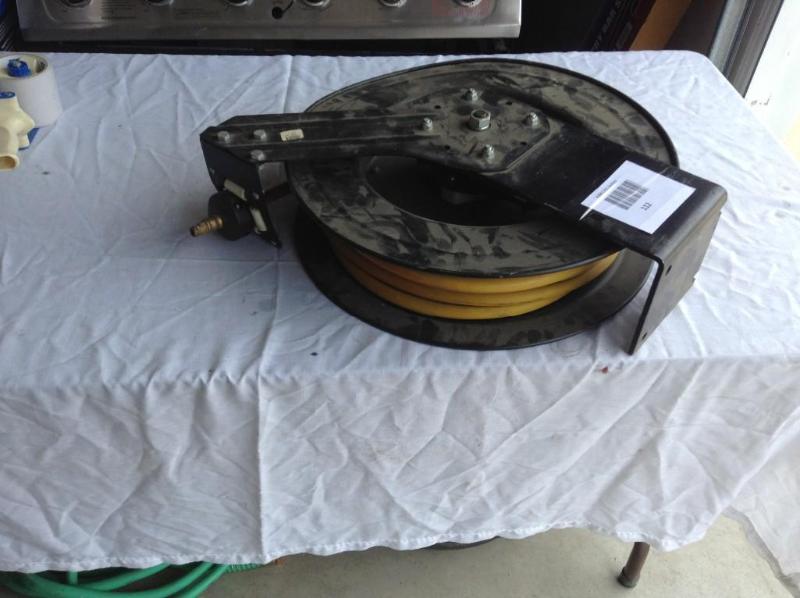 lot 112 image: Air hose reel with used air hose, u...