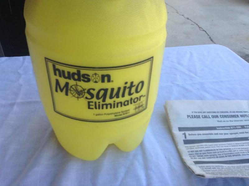 lot 41 image: Yellow 1 gallon sprayer for mosquit...