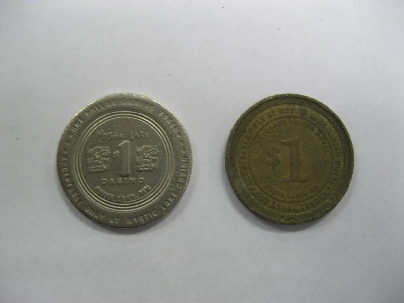 lot 33 image: Pair Of Old Mystic Lake $1 Coins...