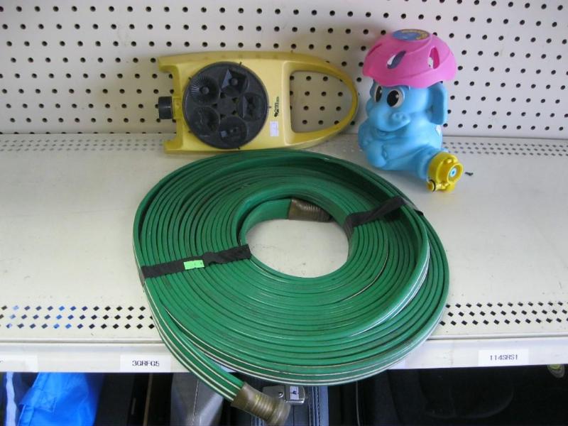 lot 77 image: Hose And Pair Of Sprinklers ...