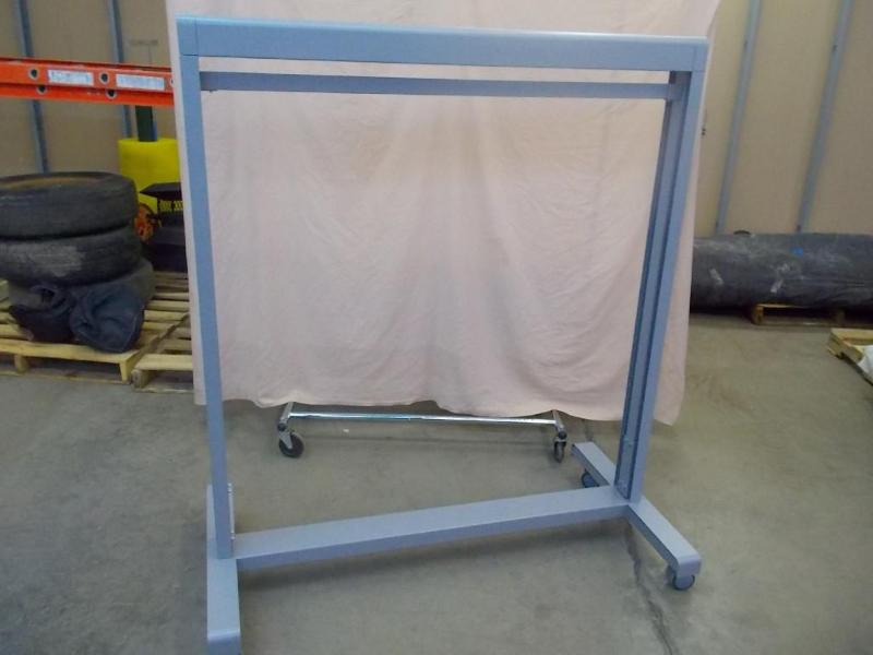 1 rolling clothes rack. Rack has lo...