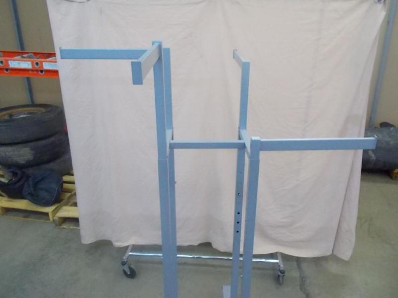 Adjustable arm display rack. Rollin...