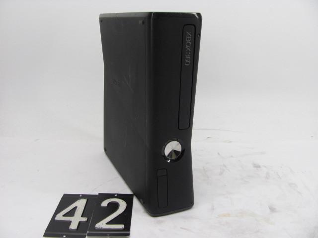 lot 42 image: Xbox 360 slim. This unit is tested ...